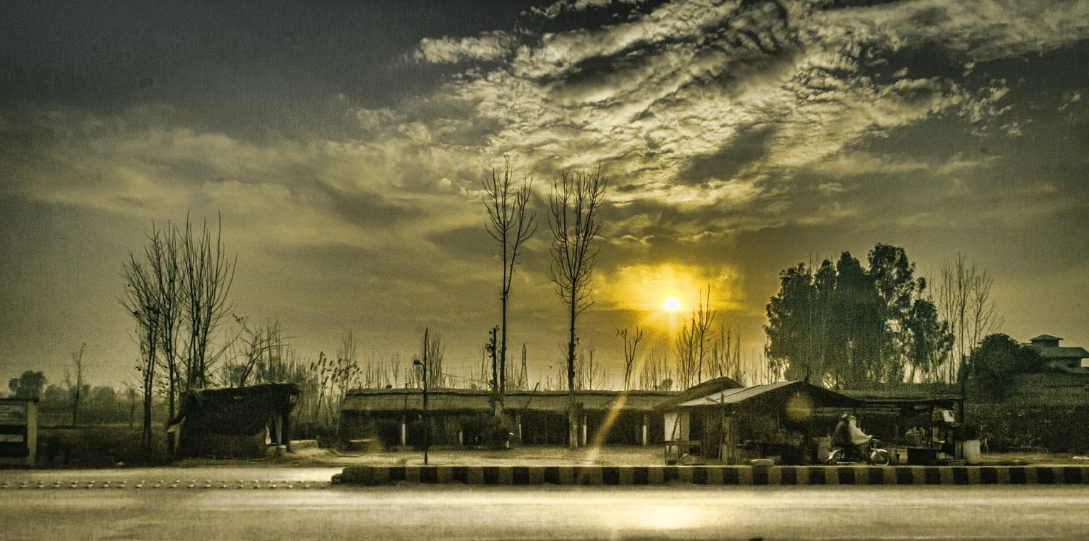 Sunset over fields and trees in Charsadda
