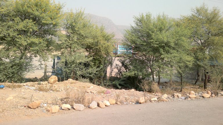 The road between Kohat and Peshawar winding through bare hills